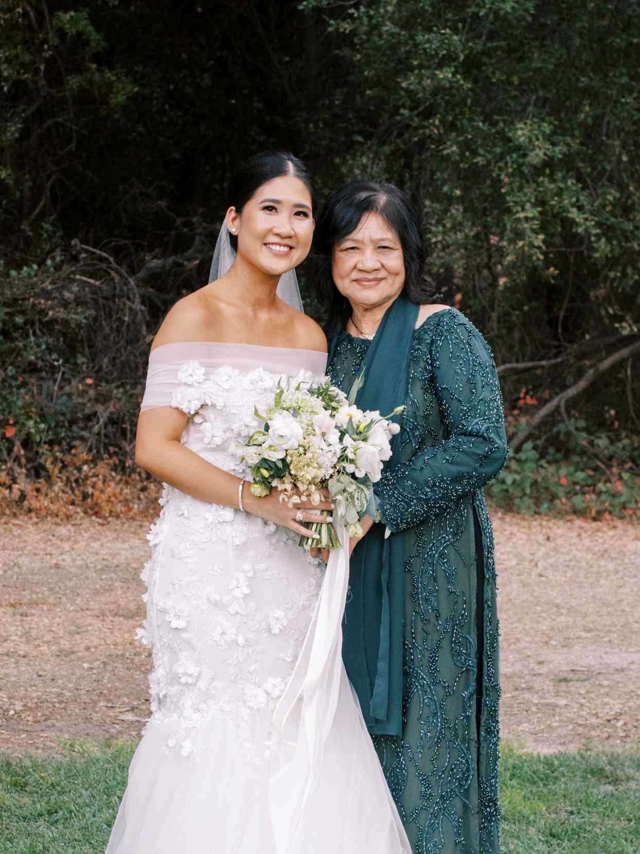 bride and mother portrait in front of forest