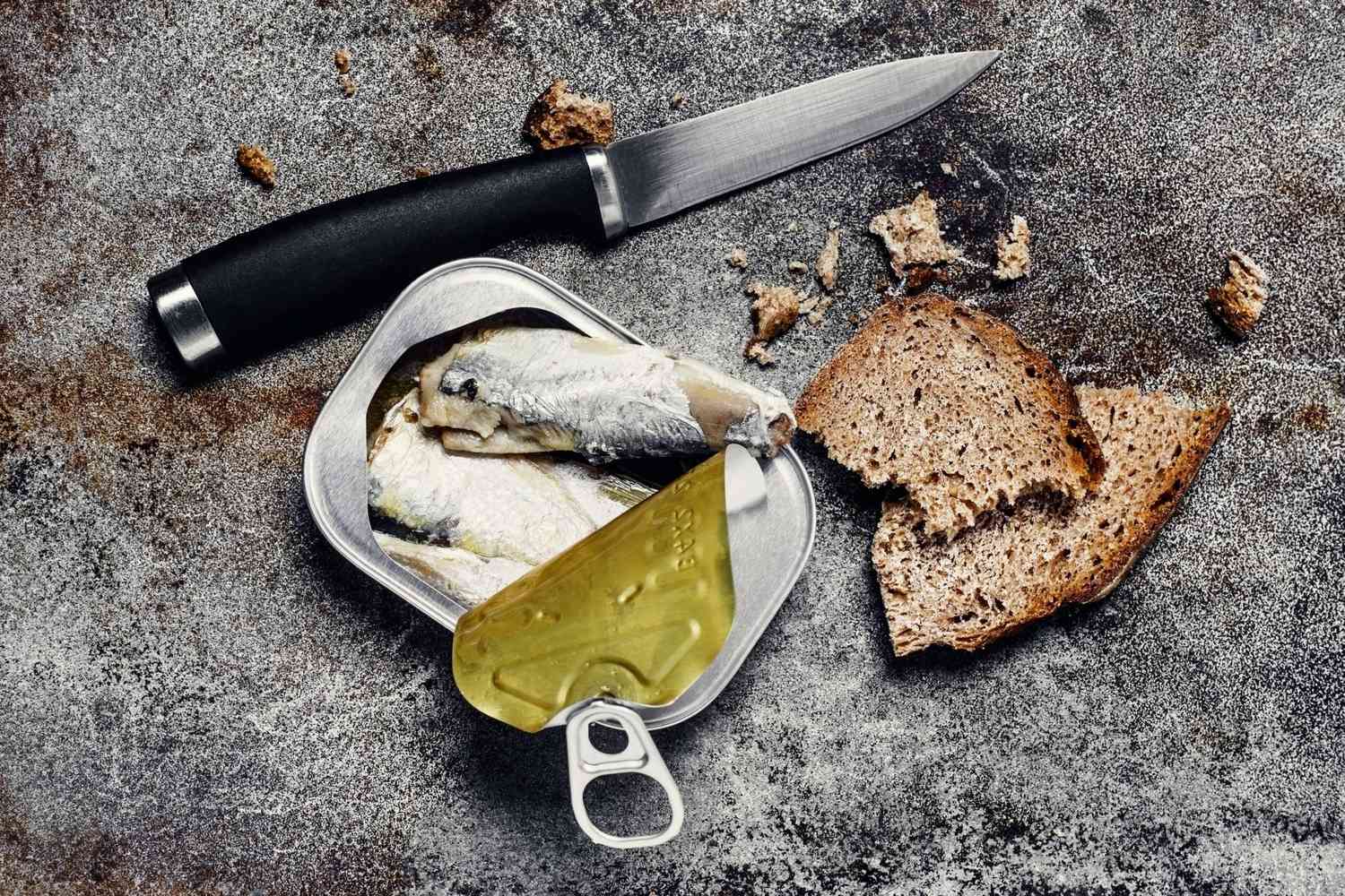 open can of sardines with bread