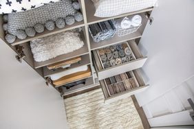 Small closet items in bin organizers