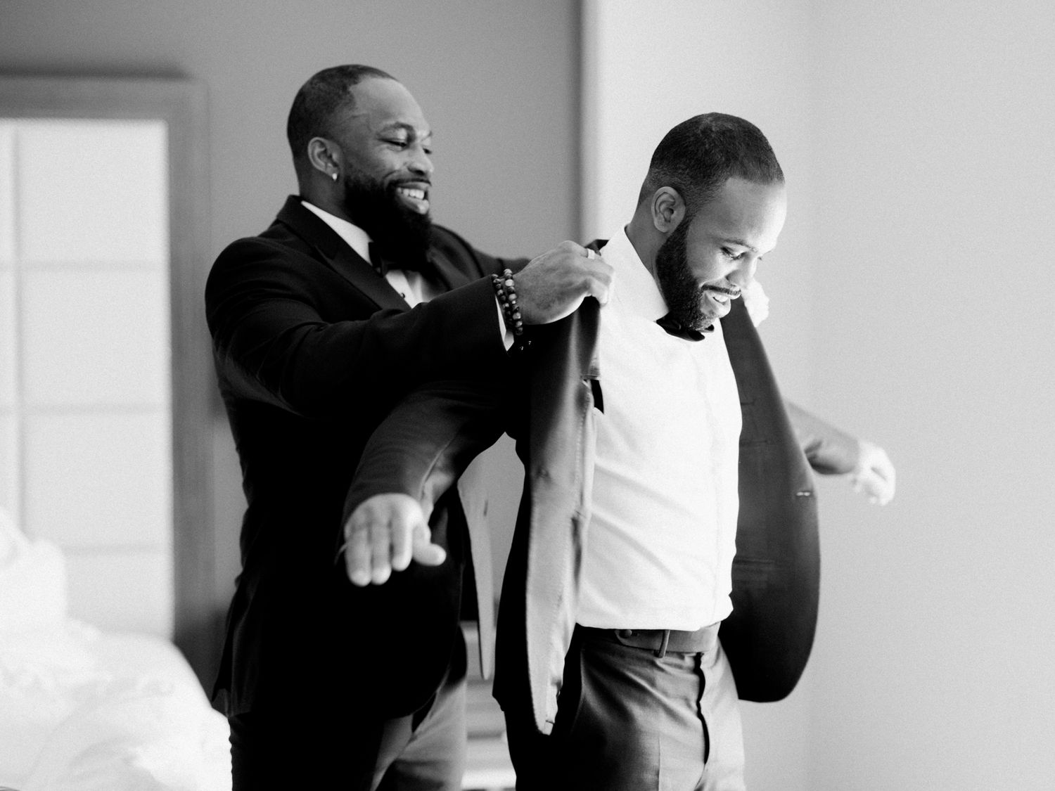 groom and groomsman getting ready