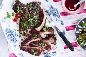 sour-cherry and five spice lacquered ribs garnished with scallions and cilantro