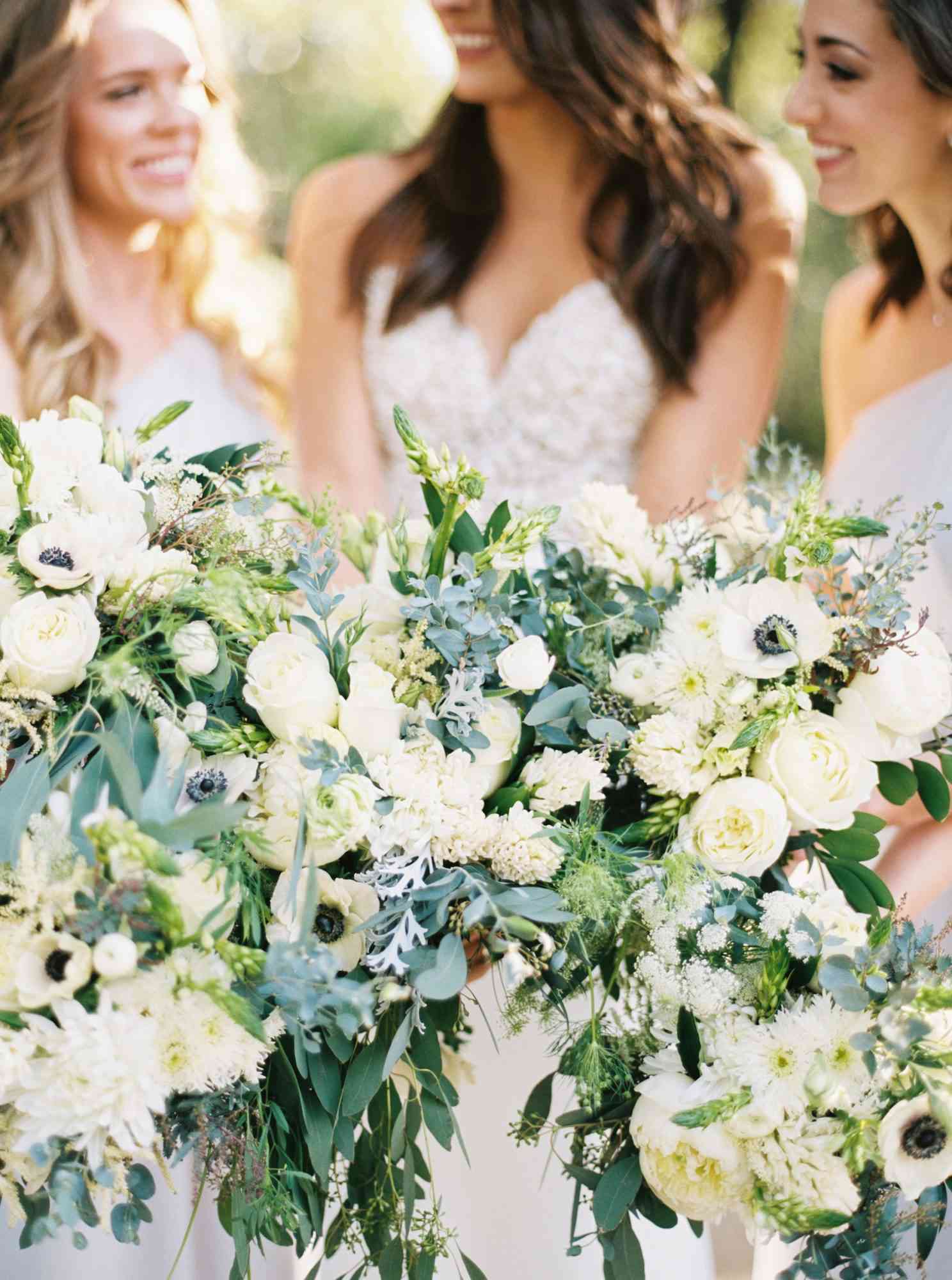 bridesmaids with white bouquets