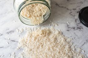 white rice in jar and on counter