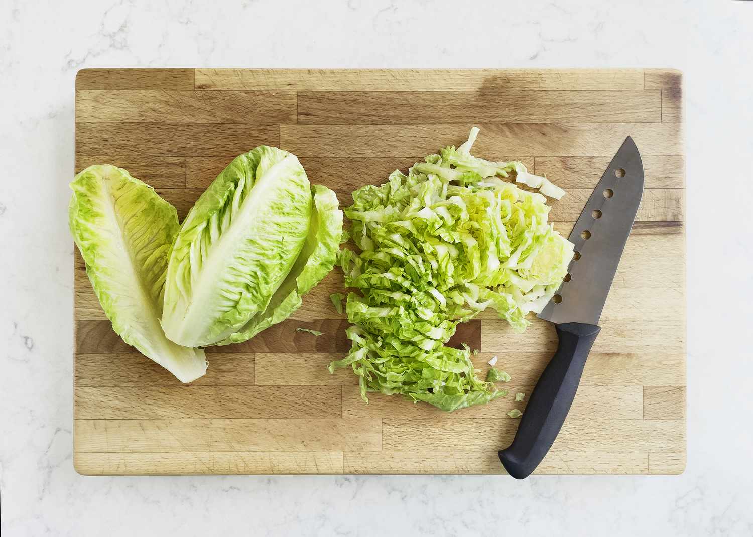 Chopped romain lettuce on cutting board