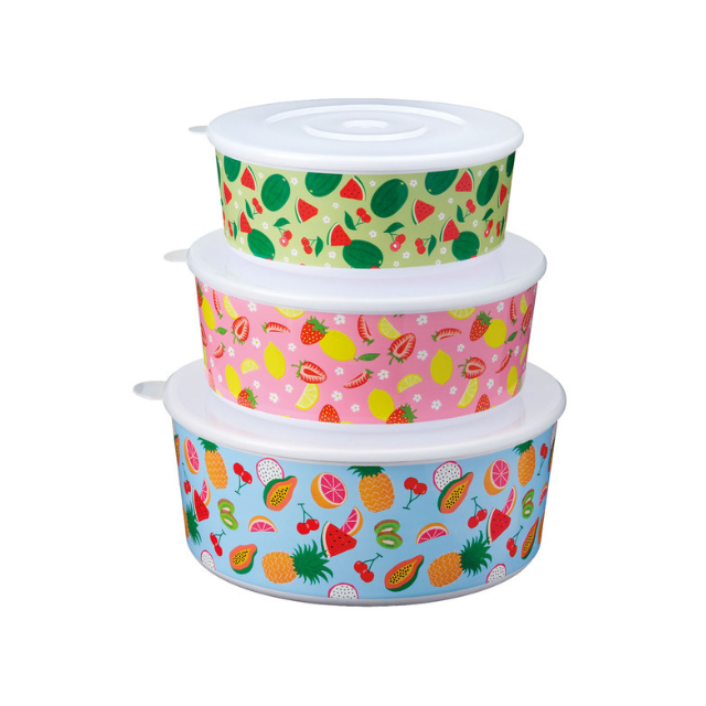 Three stacked food storage containers with tropical fruit patterns