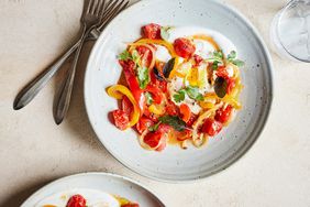 spicy braised peppers and eggs served with fresh herbs