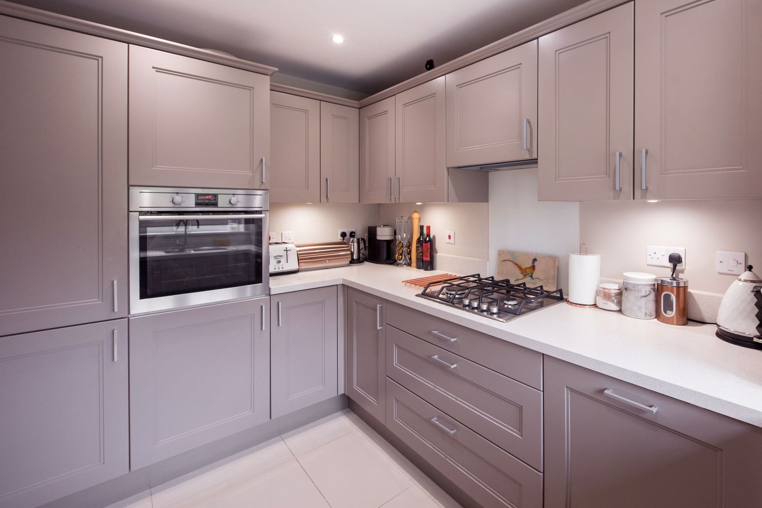 Modern kitchen interior with cabinets a builtin oven and a stovetop
