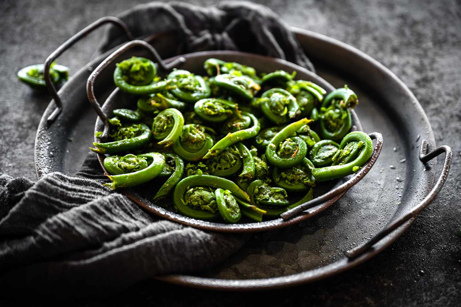 fiddlehead ferns in a pan