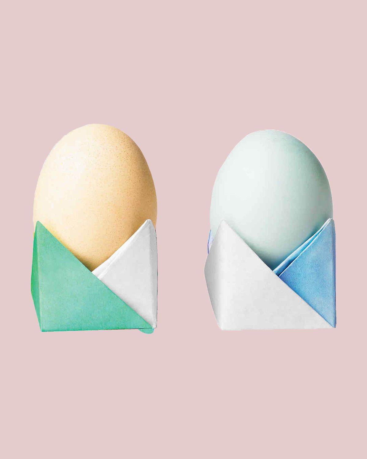 Easter eggs sitting in origami-folded paper cups