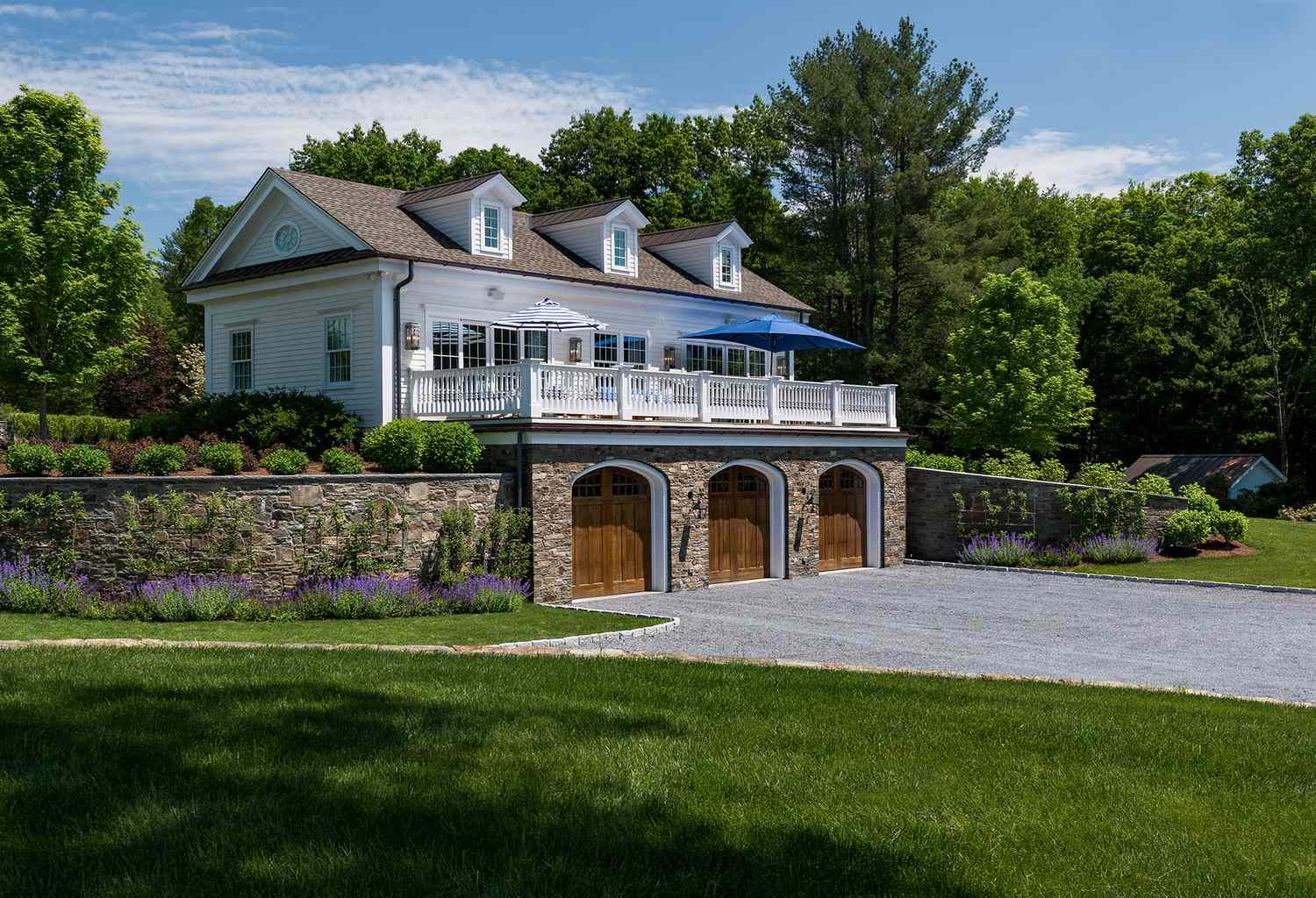 Retaining wall with stone cap home exterior