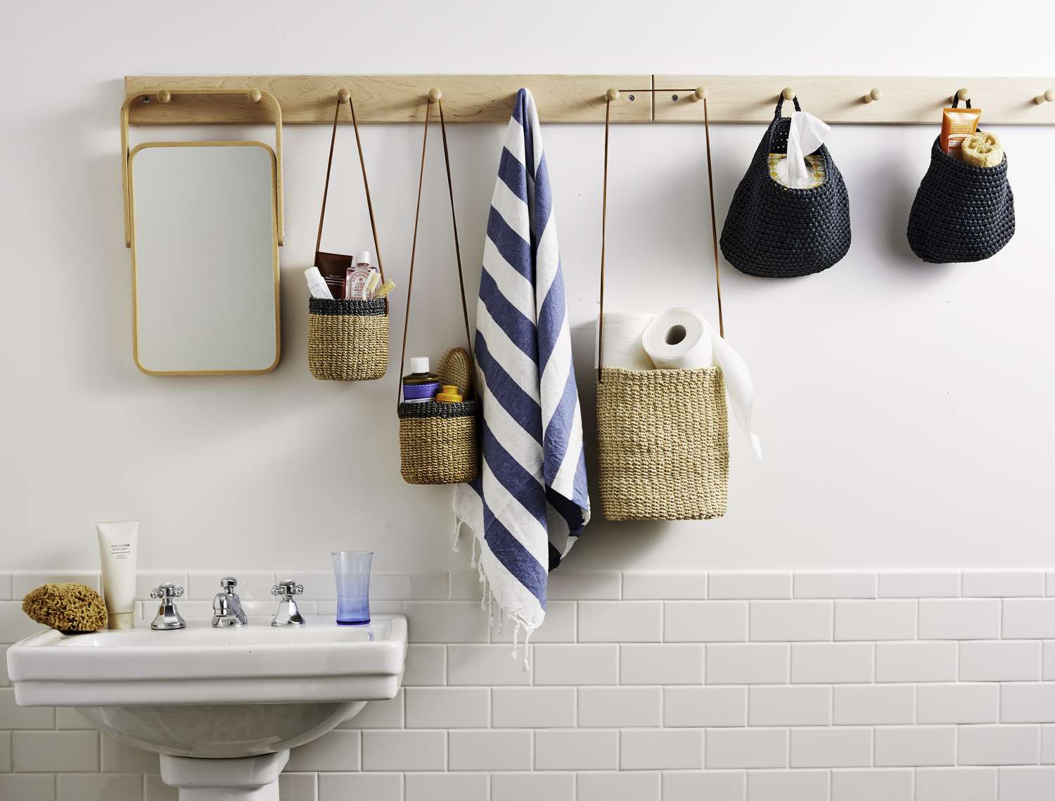 Various toiletries hanging on white wall