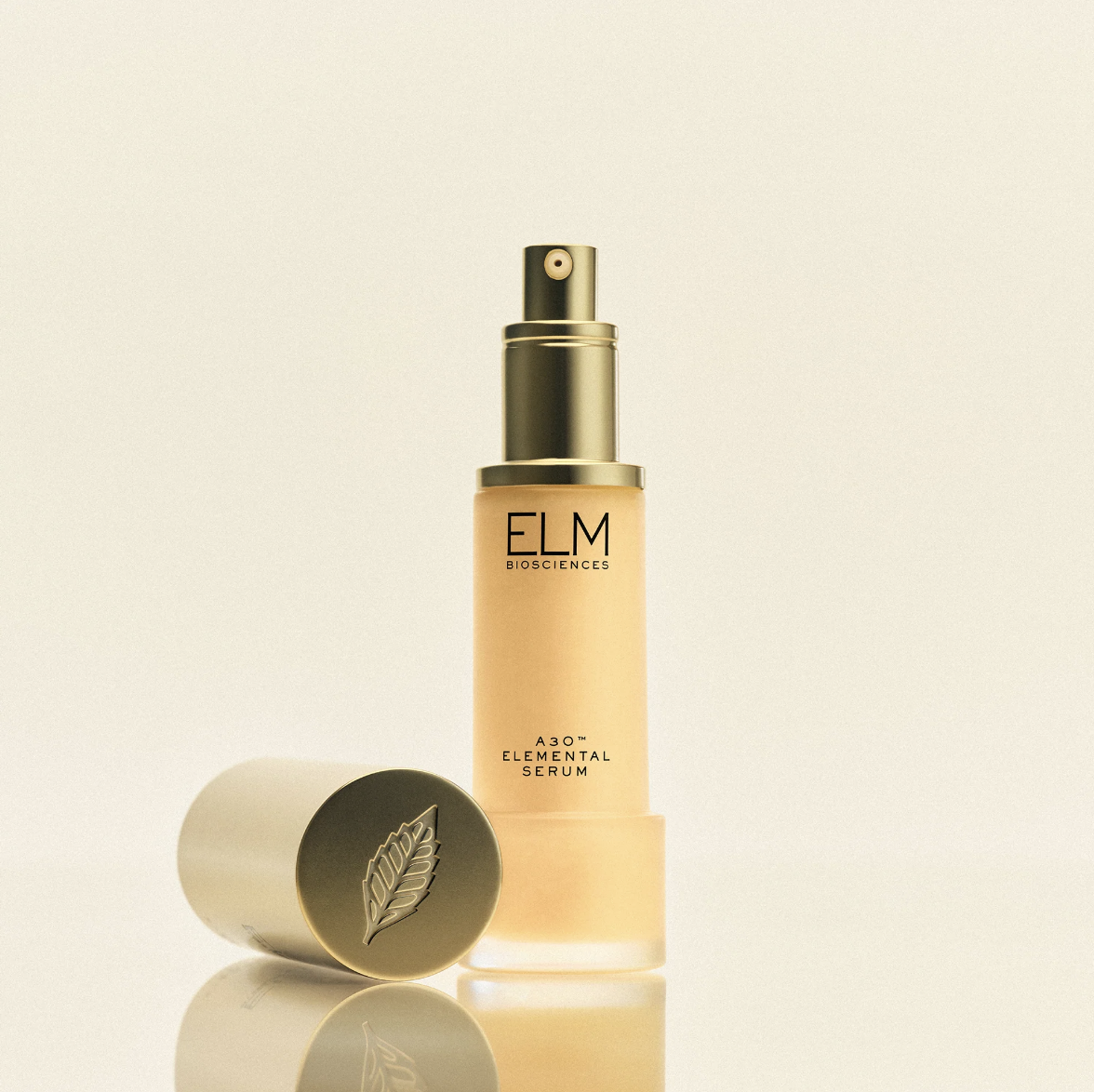 A bottle of ELM Biosciences serum with a detached cap