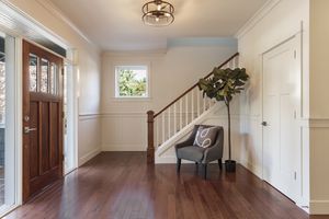 an entryway with wood floors