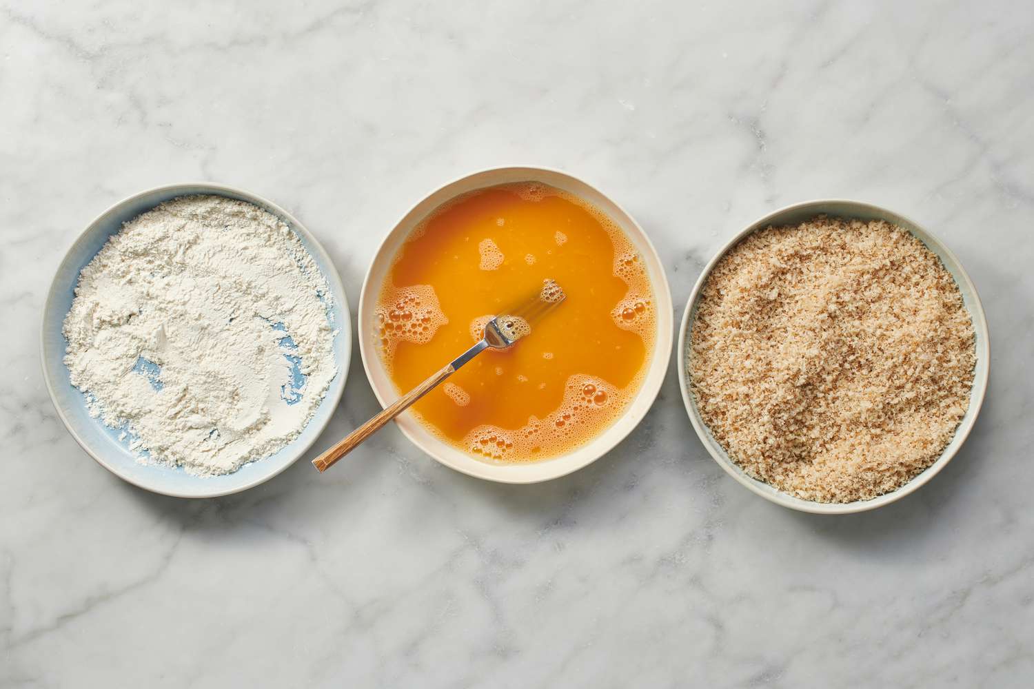dishes with flour, beaten egg, and breadcrumbs