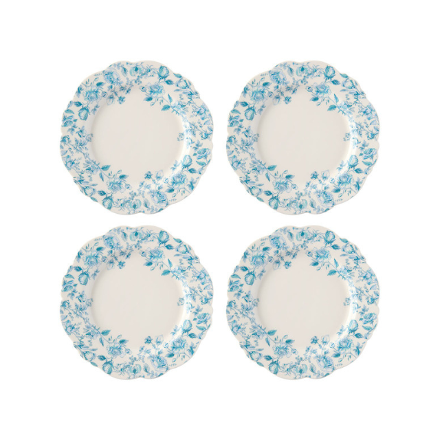 Four decorative plates with floral patterns arranged in a grid