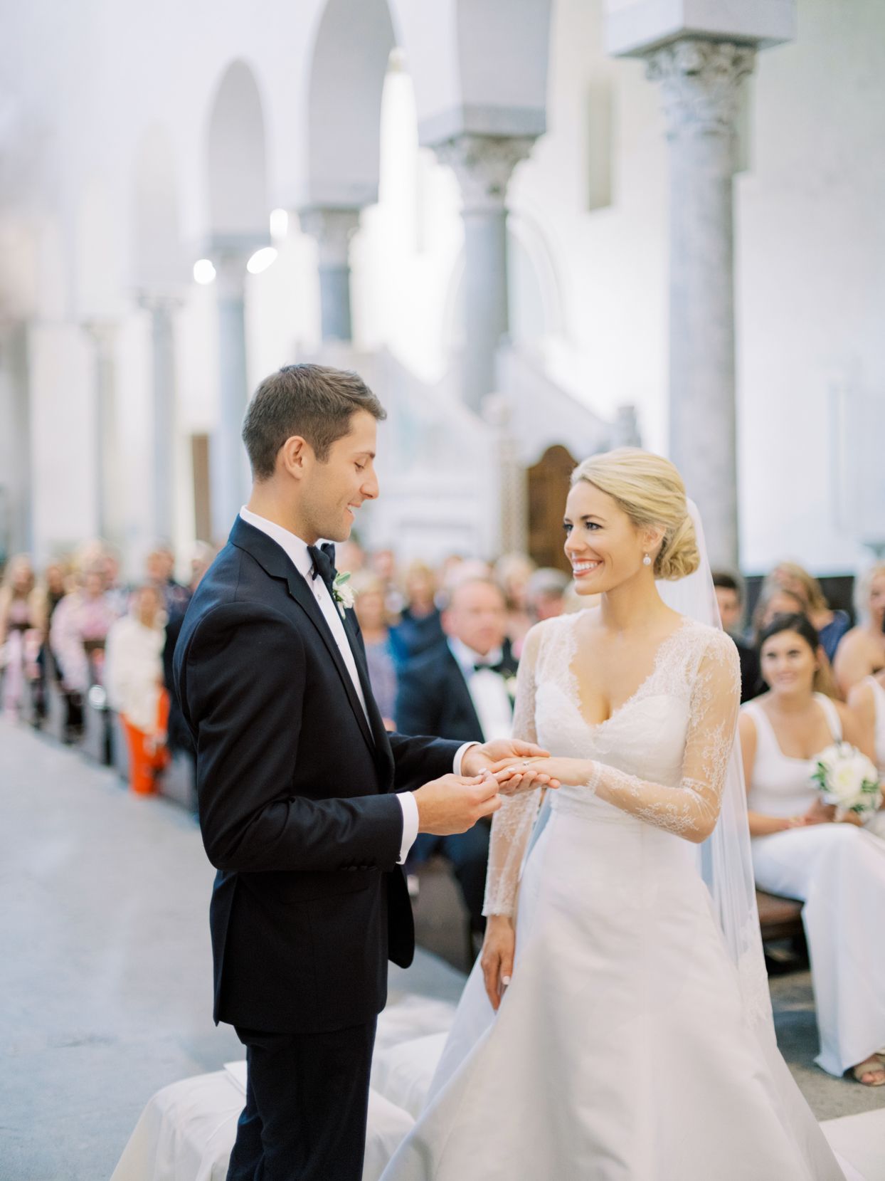 wedding couple exchanging rings in church