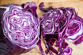 close up of red cabbage sliced on a wooden board