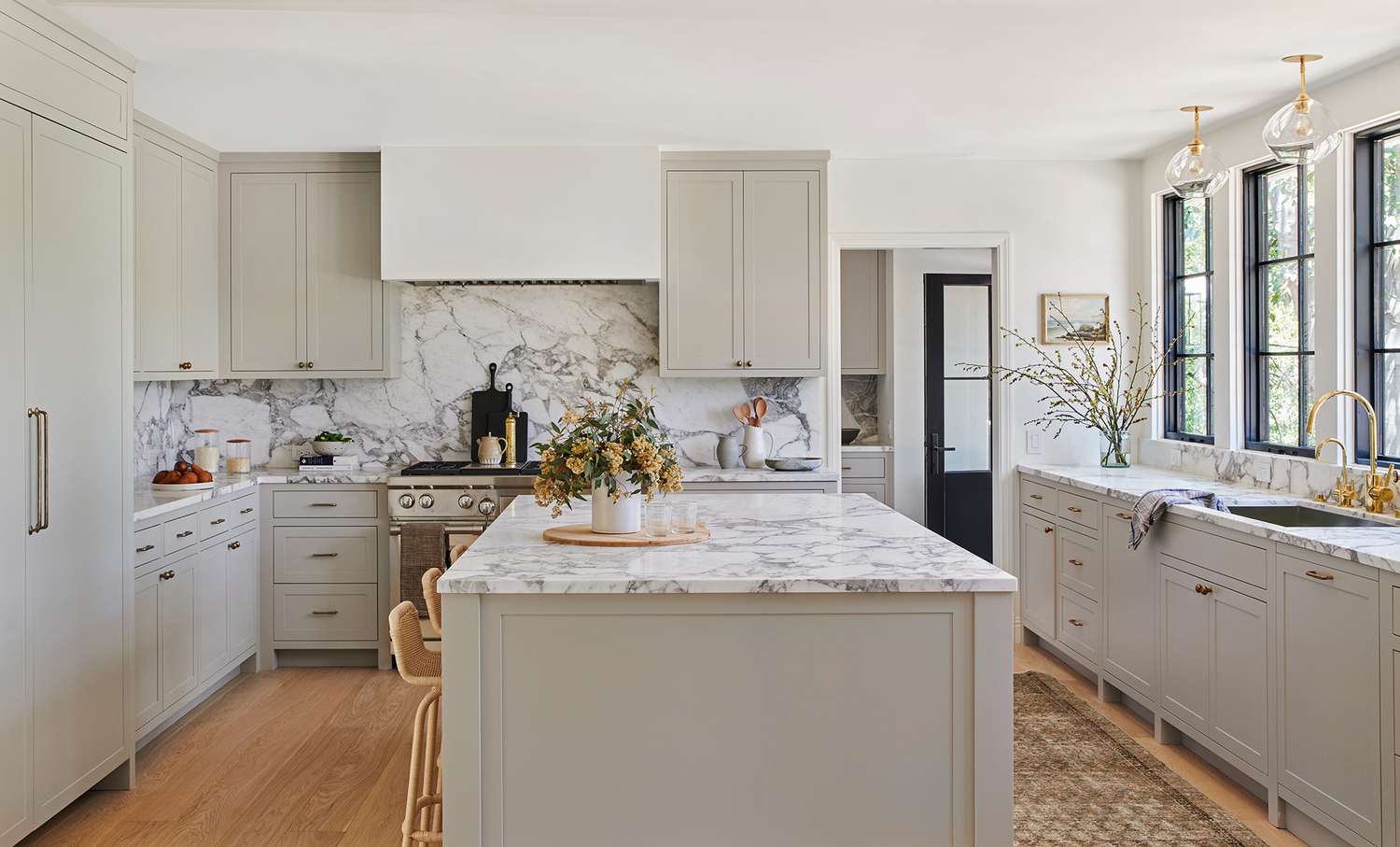 marble counter top and backsplash neutral color kitchen