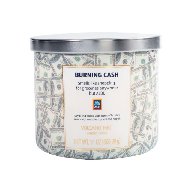 A candle with the label Burning Cash and a design featuring dollar bills
