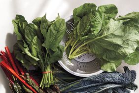 bunches of leafy greens, including spinach, kale, and Swiss chard 