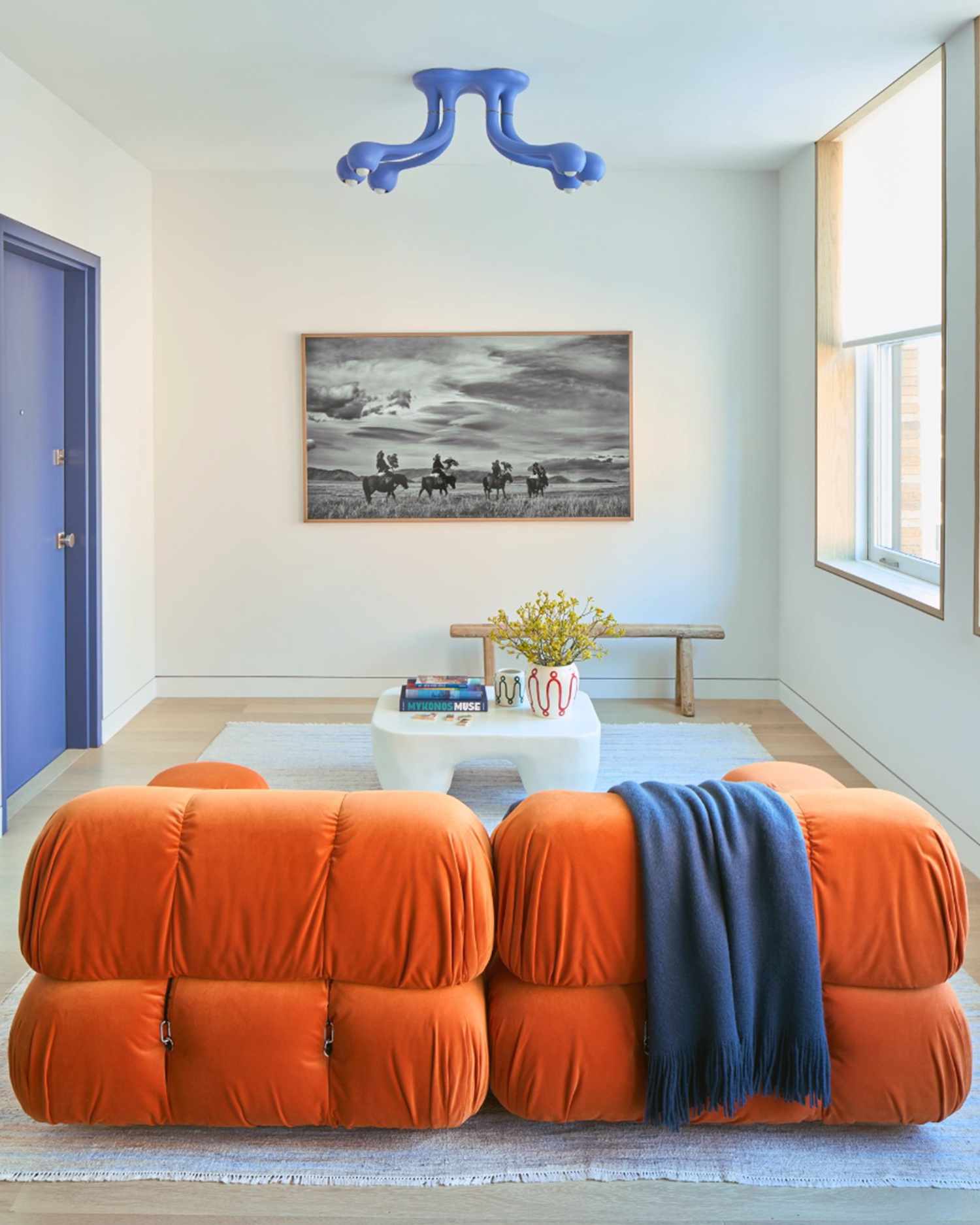 bright orange sofa in a living room