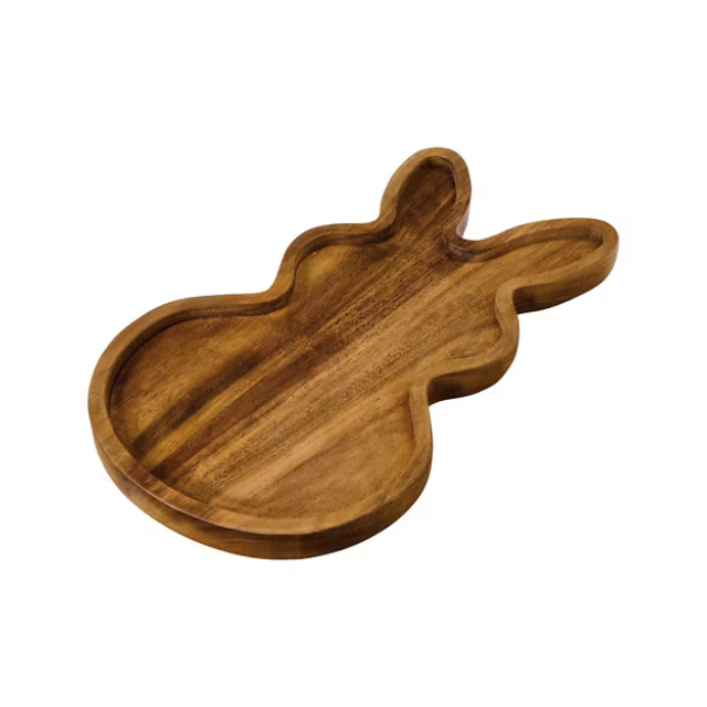 A wooden serving tray shaped like a rabbit
