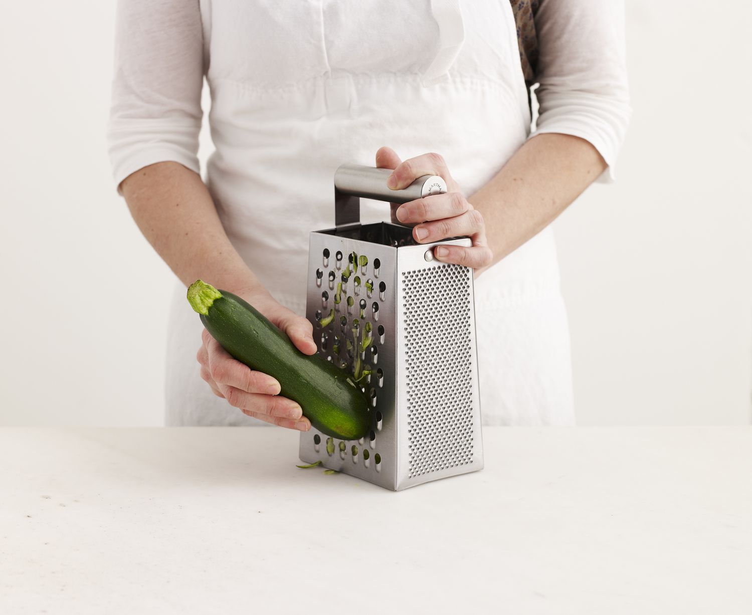 Box grater with zucchini
