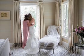 Mother and Daughter Looking Out the Window