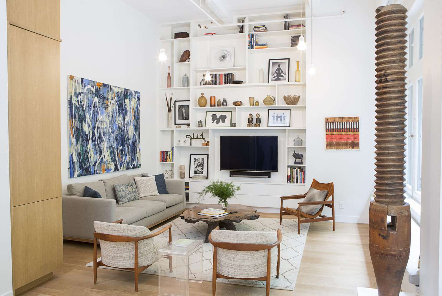 floor to ceiling white wall built in shelf living room
