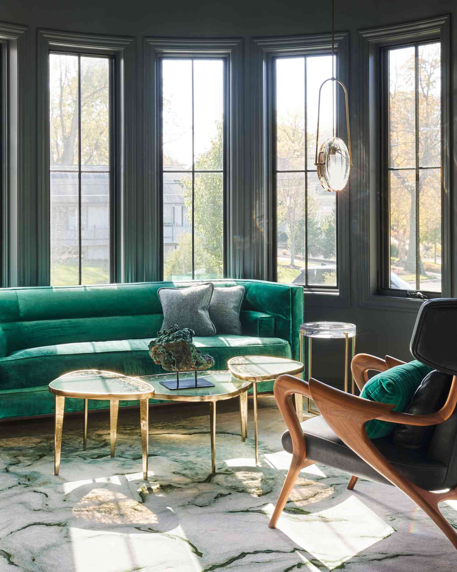 Green living room with gold coffee table