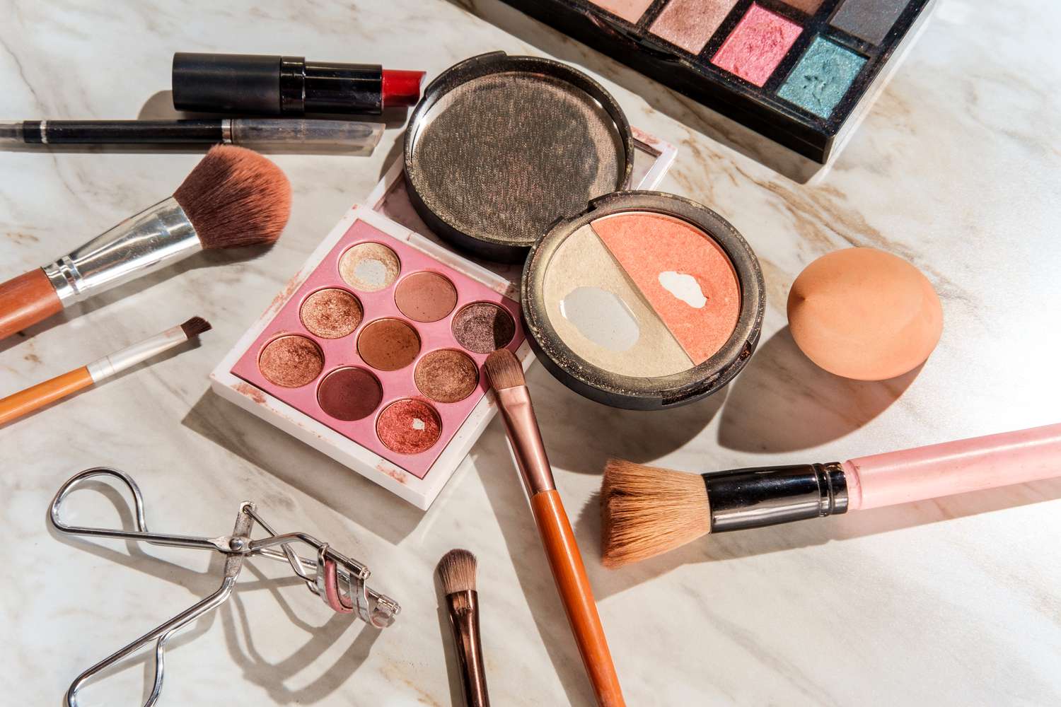 Beauty and cosmetics theme used makeup kit on marble bathroom table