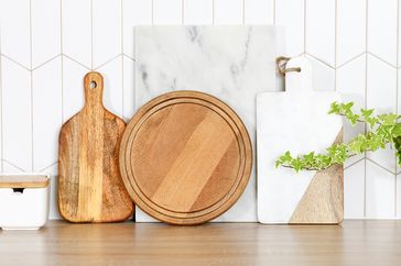 Various cutting boards arranged on a kitchen counter