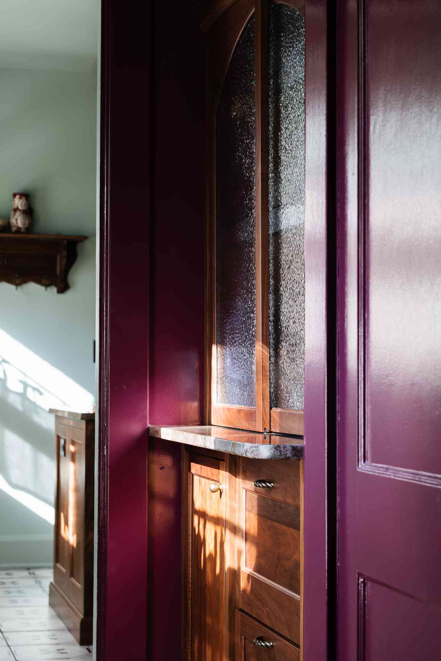hallway with dark and wooden built-ins