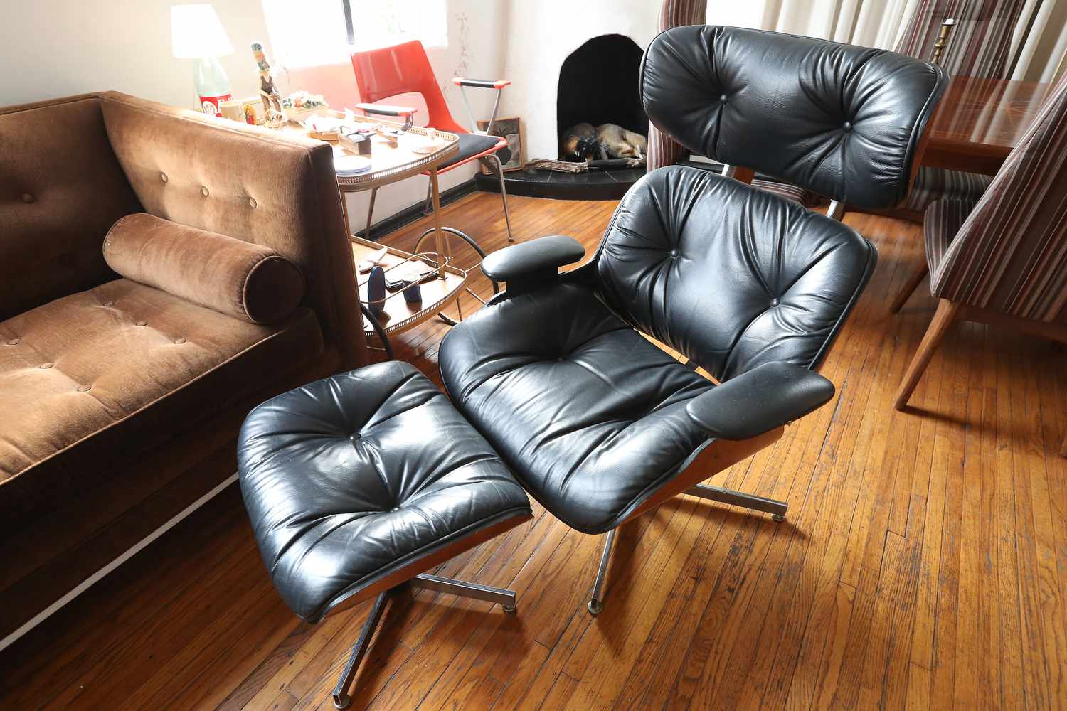 Eames lounge chair with ottoman in a living room setting
