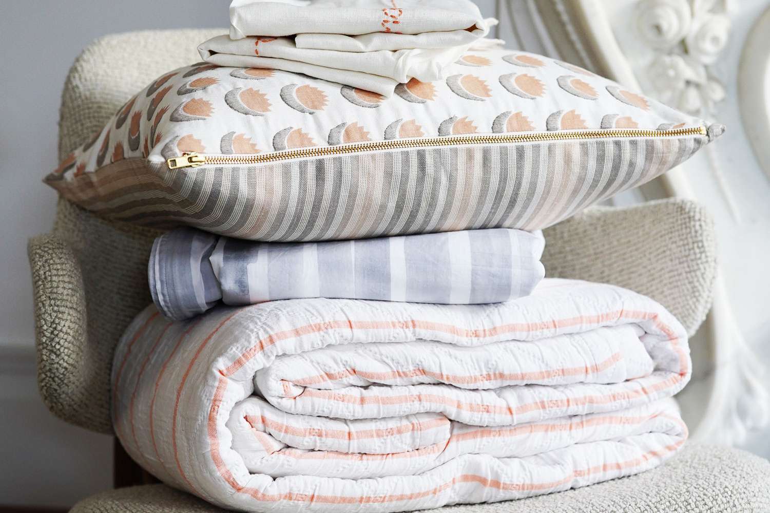 Organic cotton bedding folded on chair