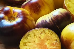 Heirloom tomatoes some sliced open to reveal the interior