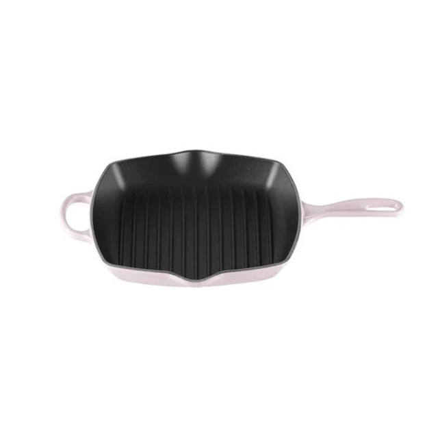 A square cast iron grill pan with a handle and a ridged cooking surface
