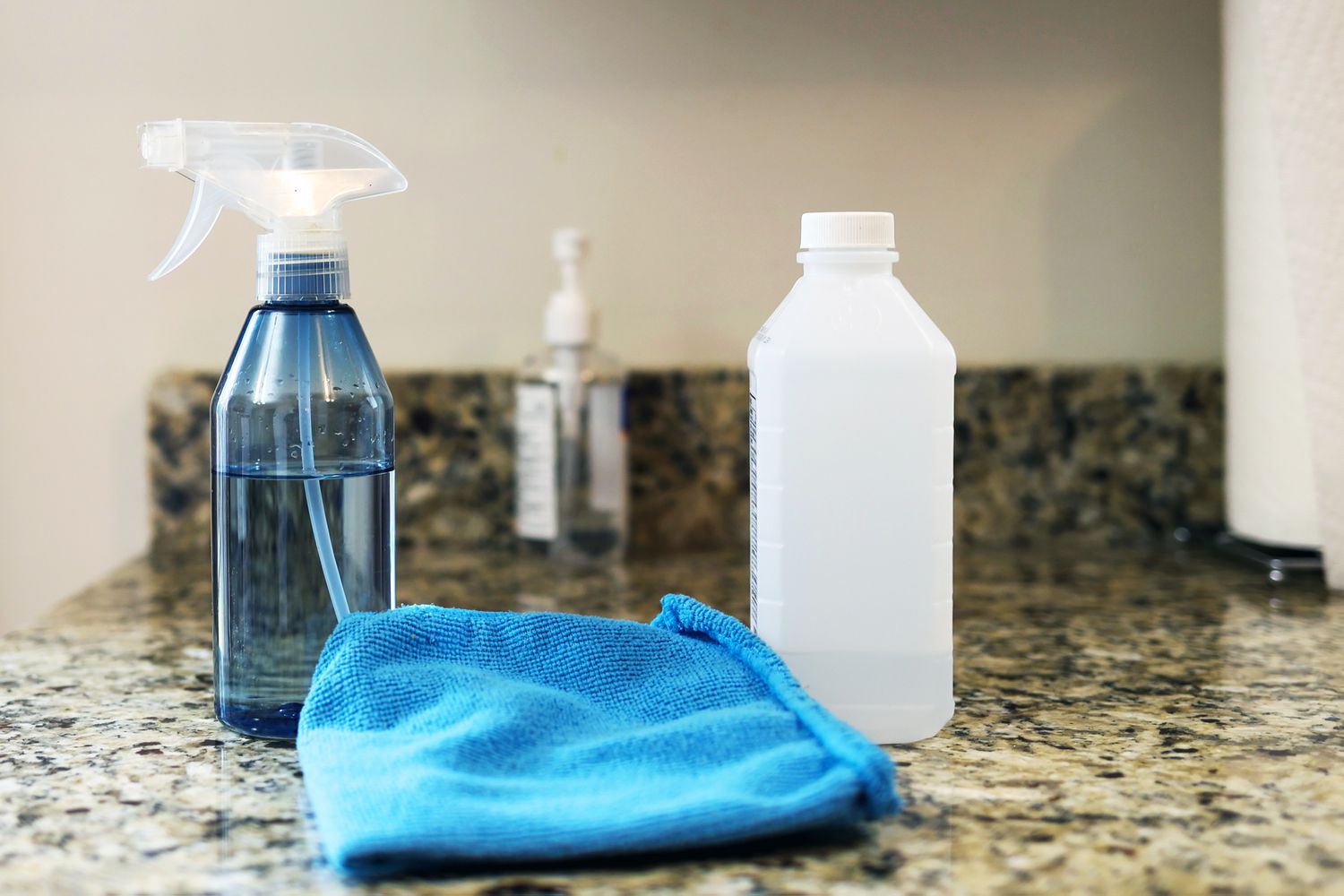 Rubbing alcohol and spray bottle with towel