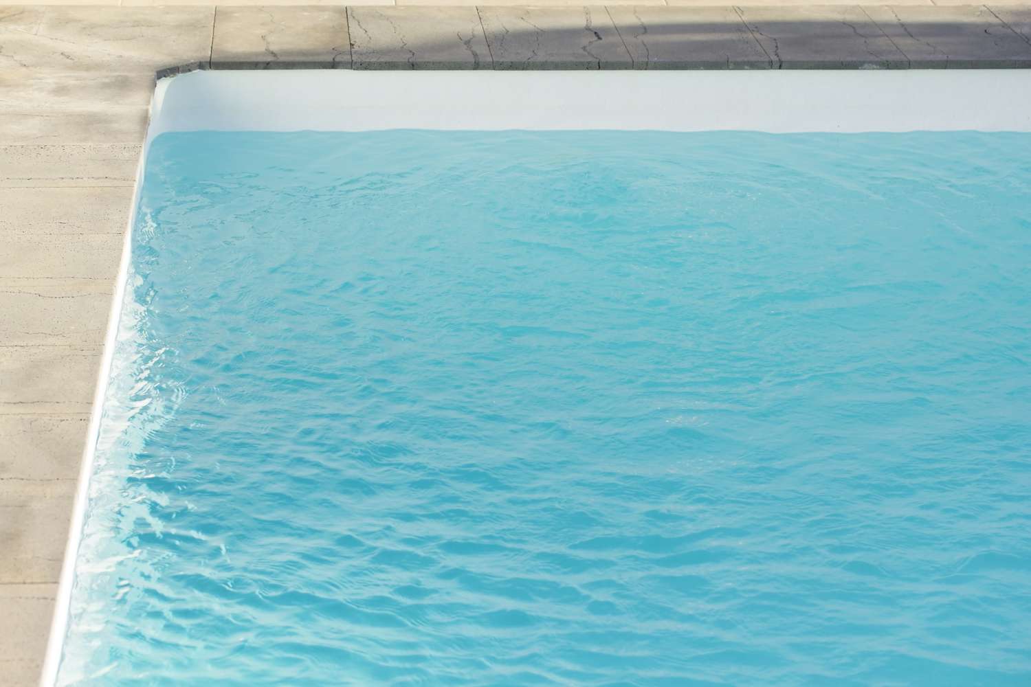 A swimming pool bordered by a tiled edge