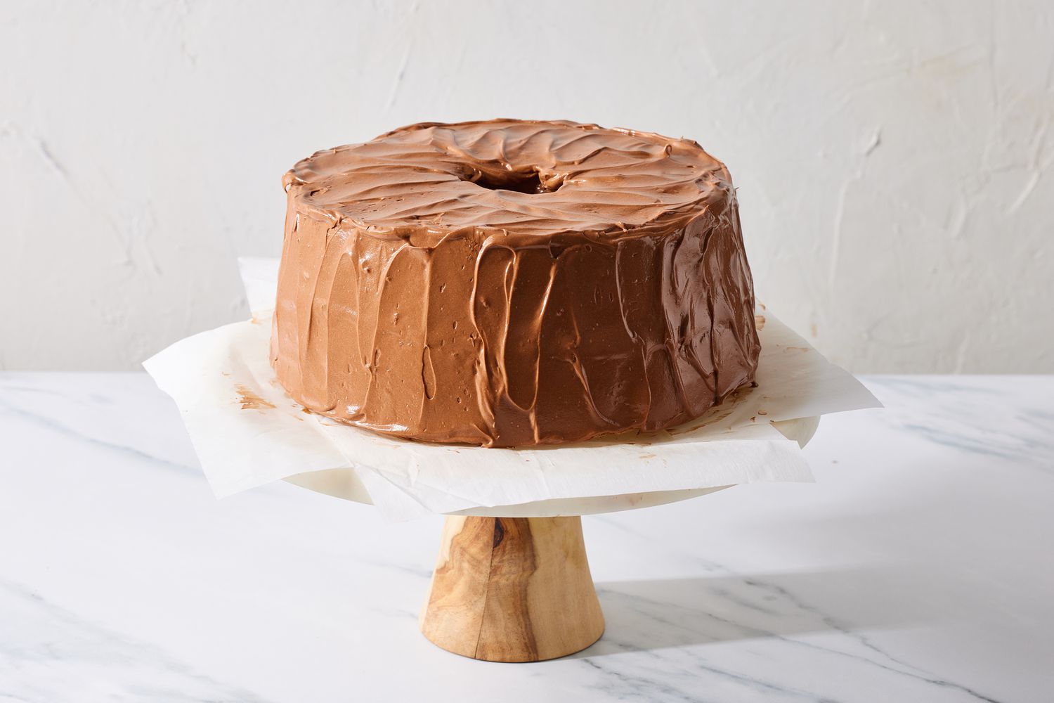 Frosted cake on cake stand