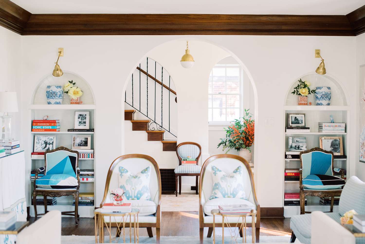 Living room with arched bookshelves