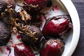 roasted beets in a dish, unpeeled