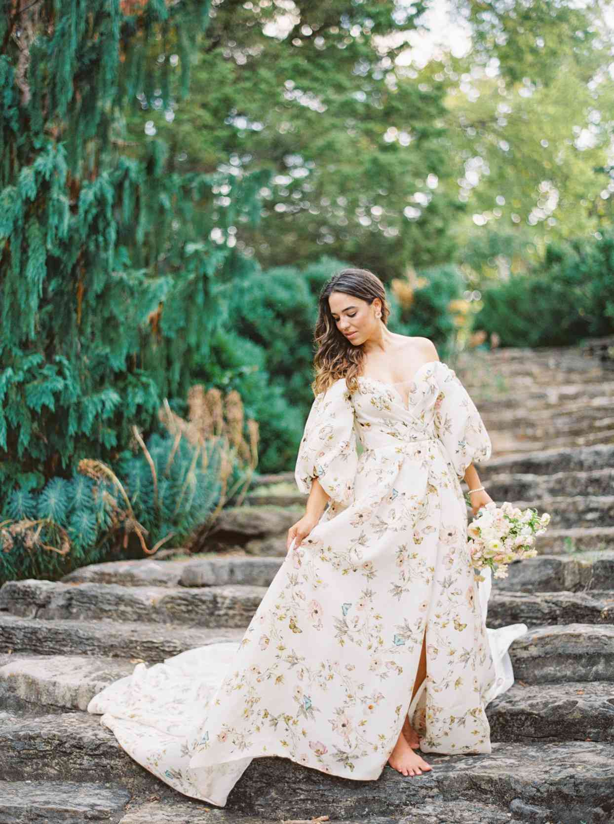 bride barefoot in white floral patterned wedding dress