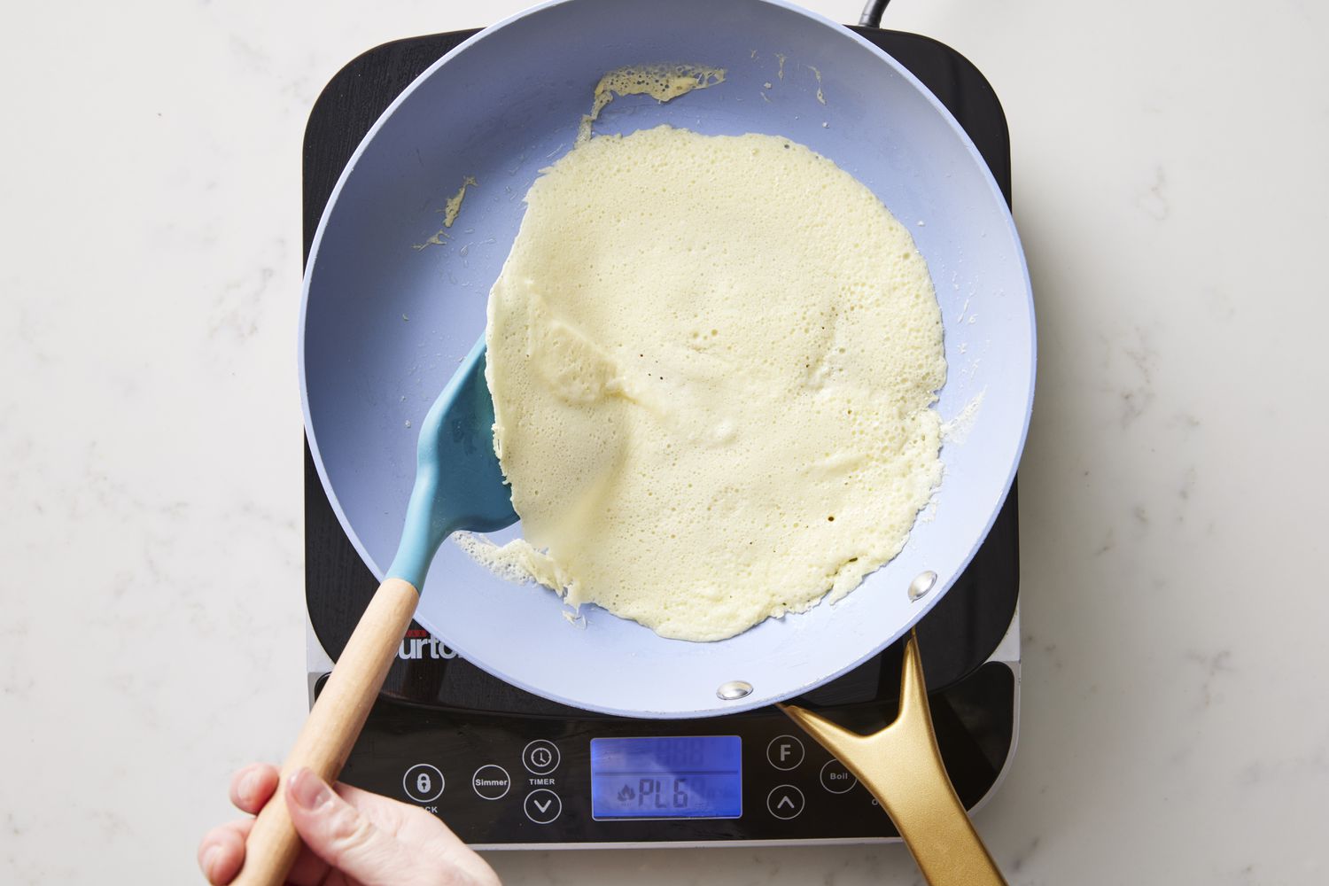 Flipping crepe in skillet
