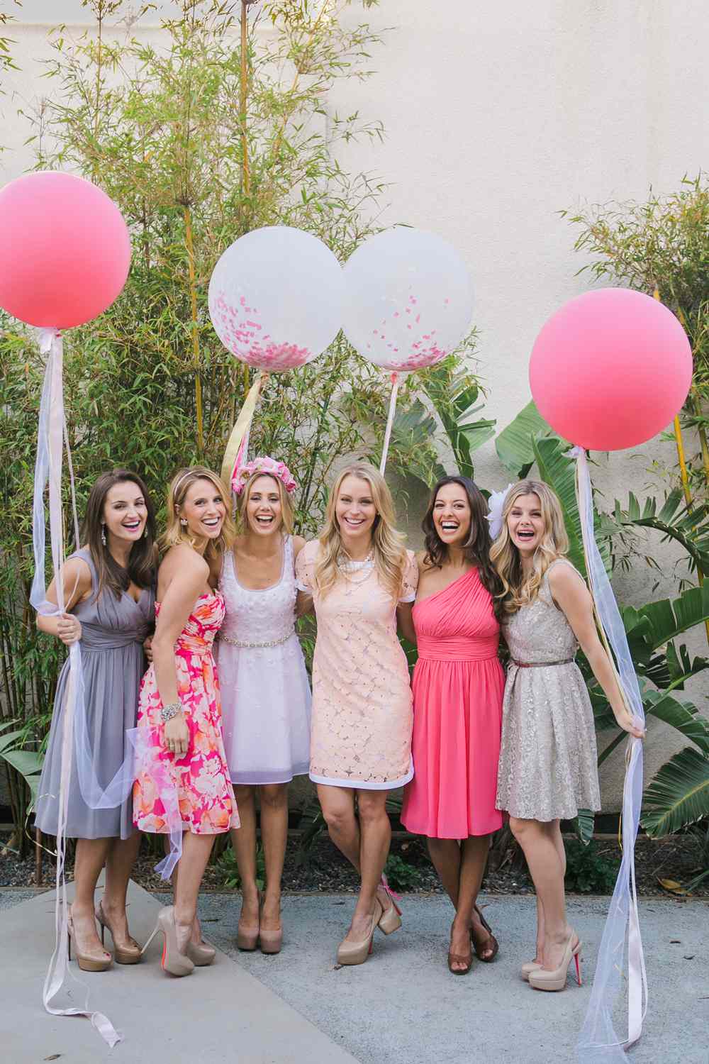 be my bridesmaid girls holding pink balloons