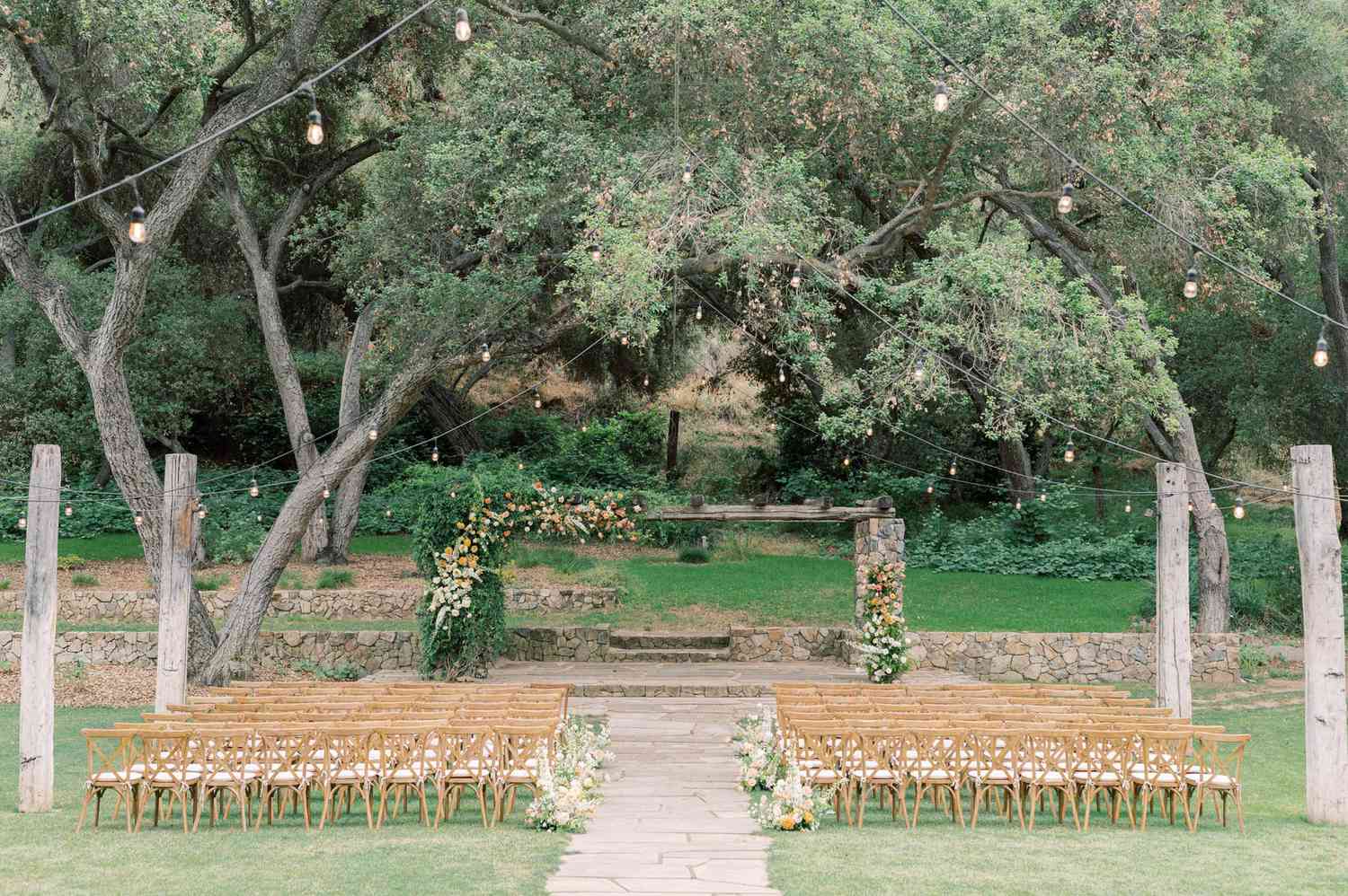 outdoor wedding ceremony wooden chairs set up