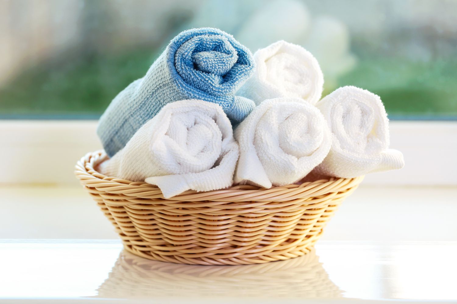 Rolled towels in basket