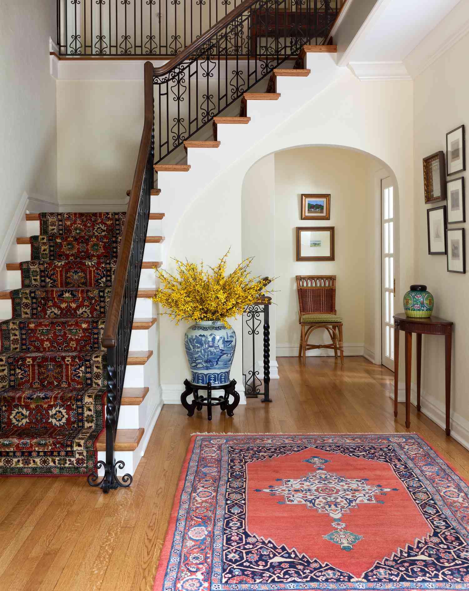iron and wood staircase with patterned runner