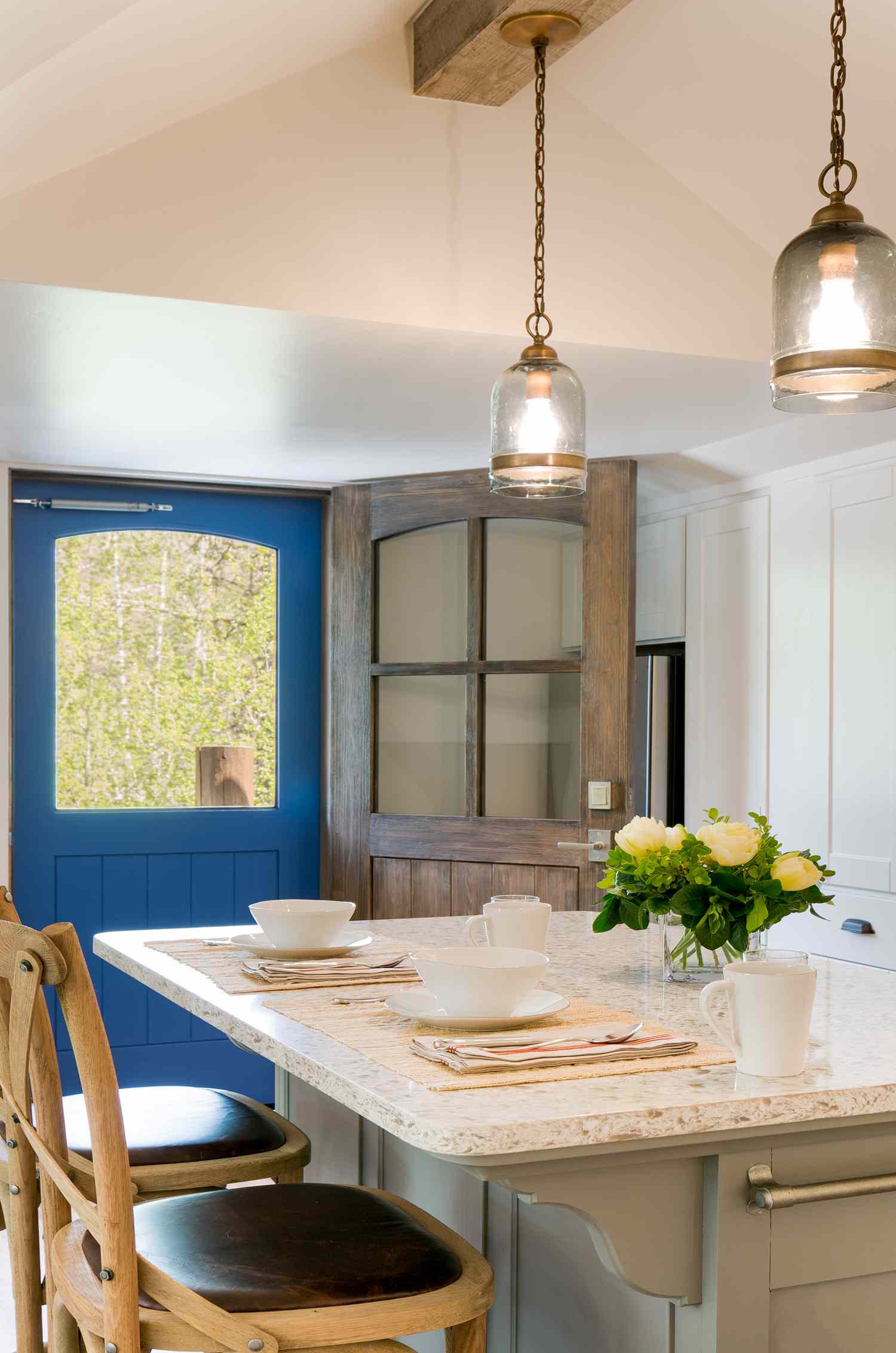 tiny home kitchen with blue door