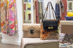 handbag and colorful textiles in a shop